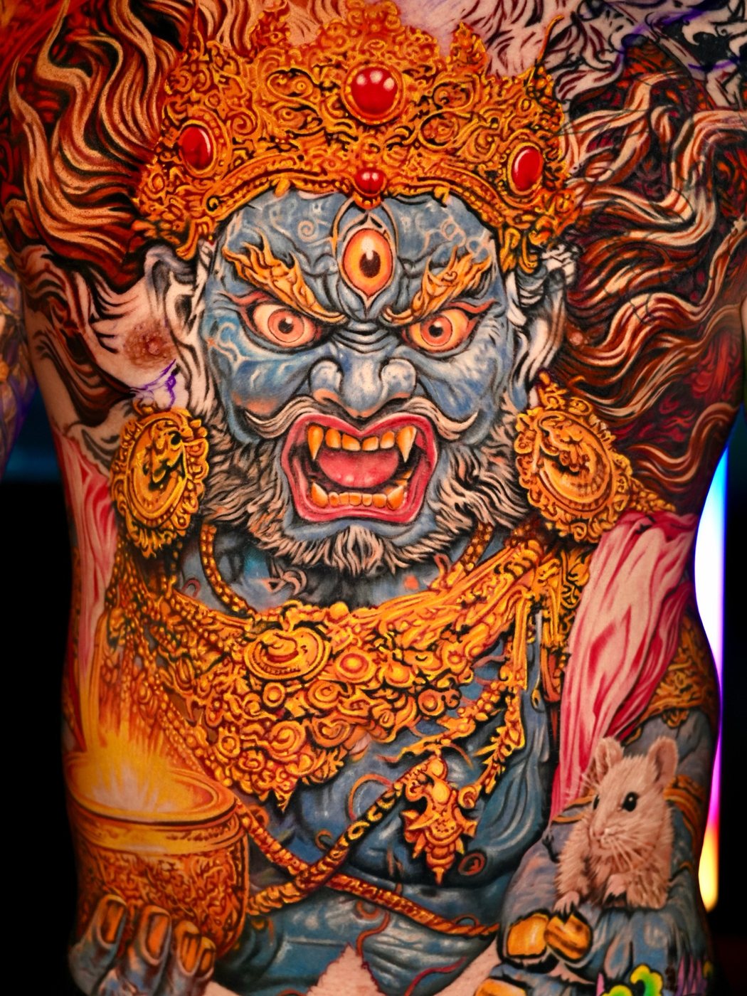 Wrathful deity back piece in orange and gold